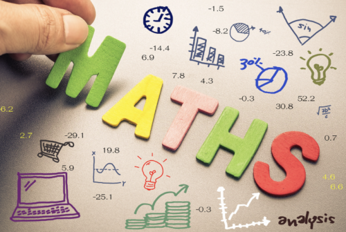 Image with Maths and doodles of math notations and a laptop.